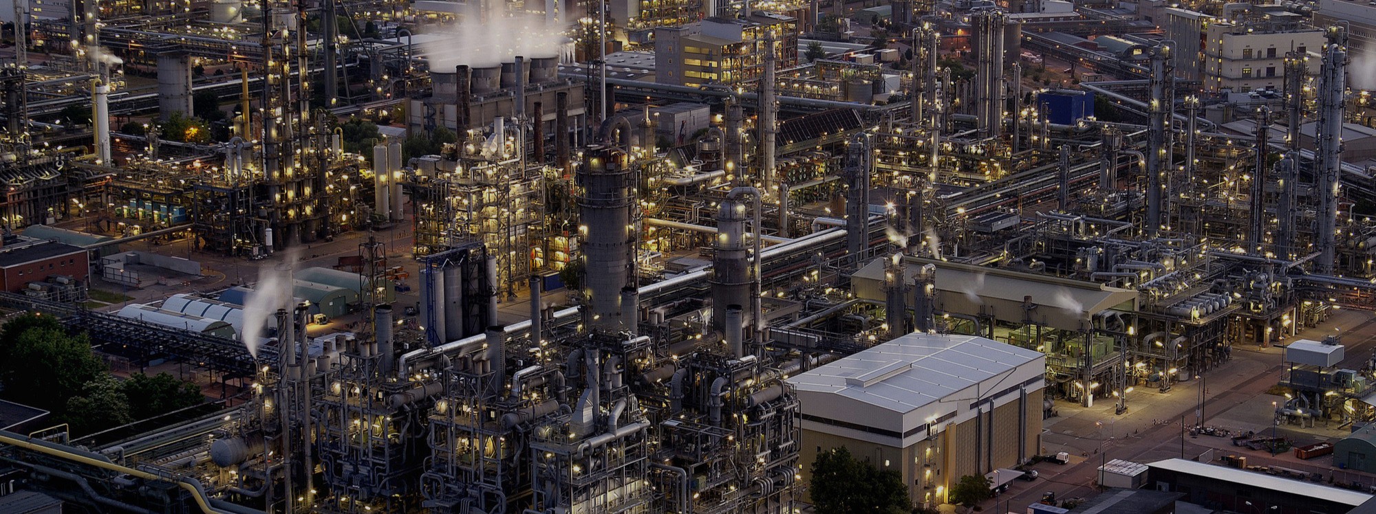 Petrochemical plant background for anti-coking coatings banner.